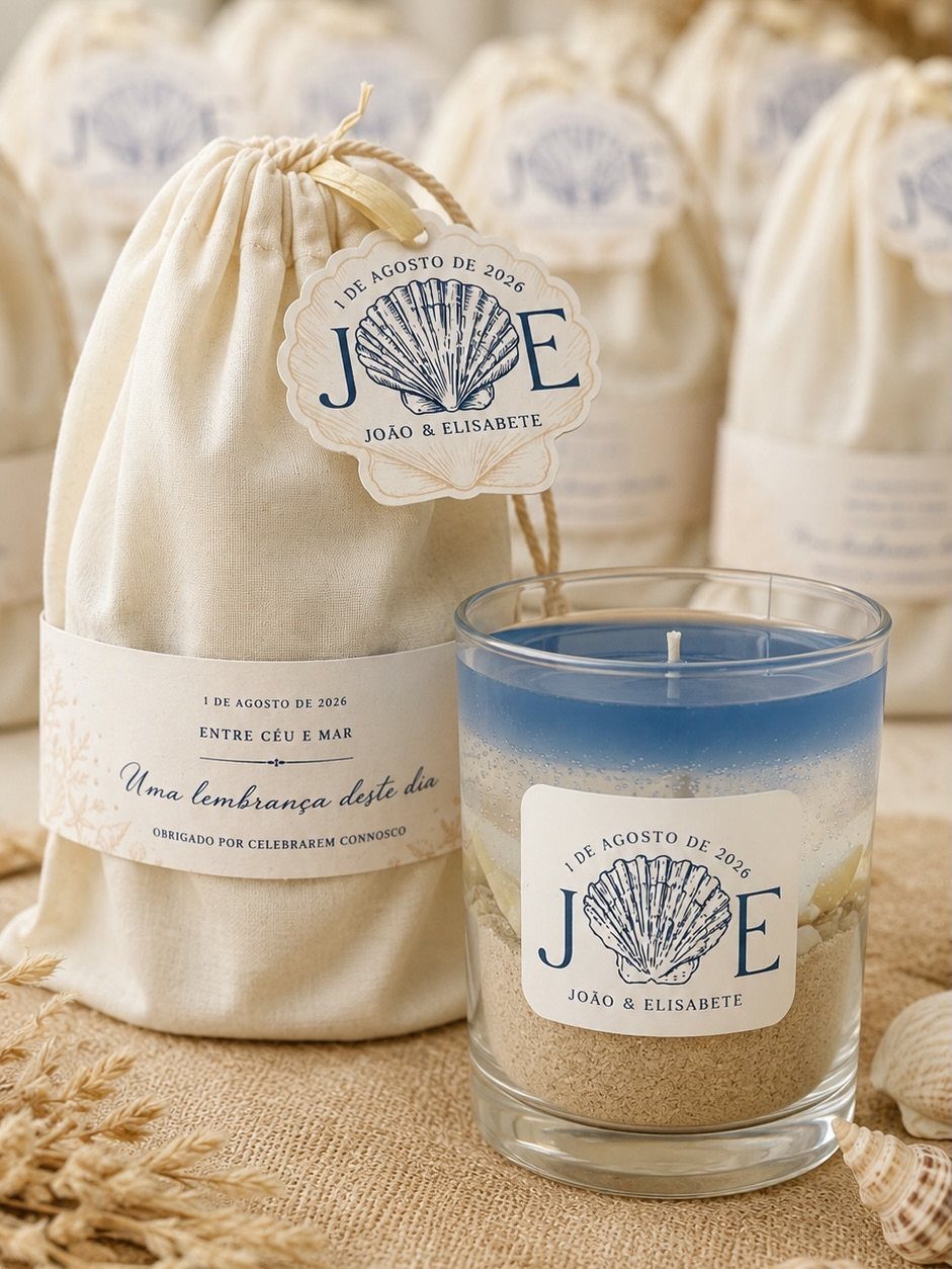 Layered blue and white candle with sand and matching fabric favor bags.