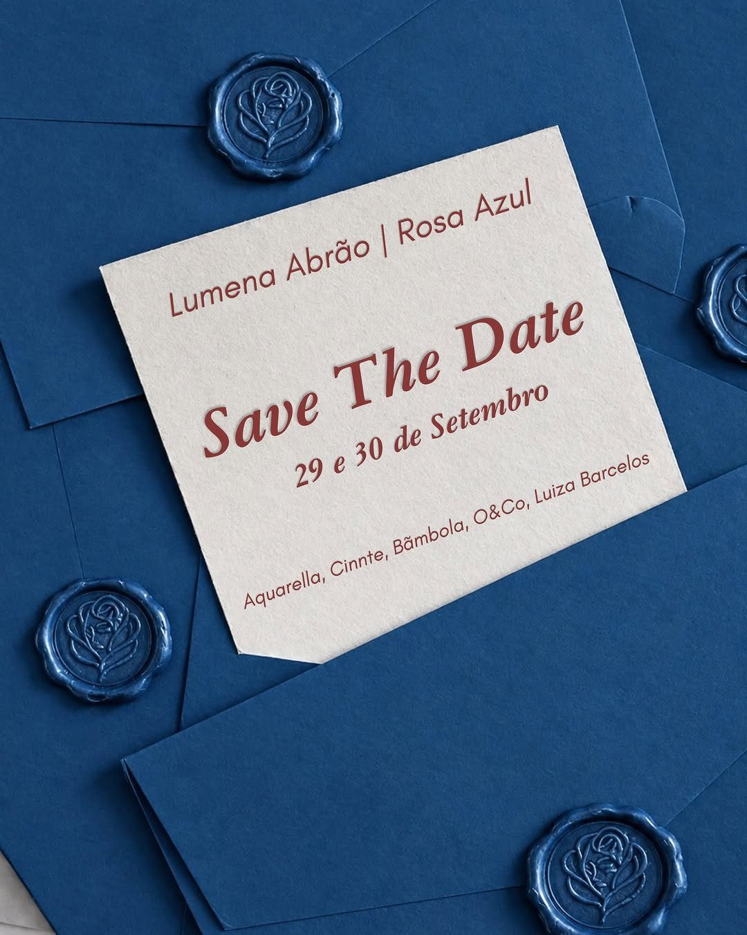 Save the date card with red text on blue envelopes with wax seals