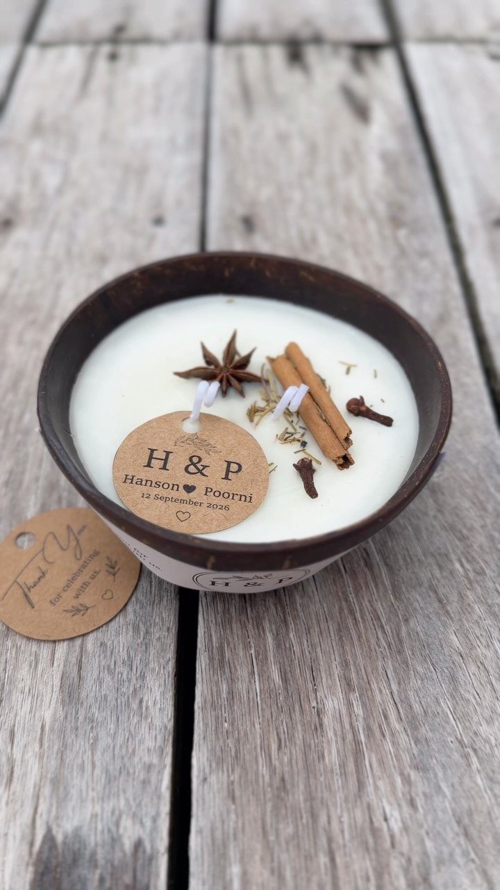 White coconut shell candle with cinnamon and star anise and personalized wedding tags