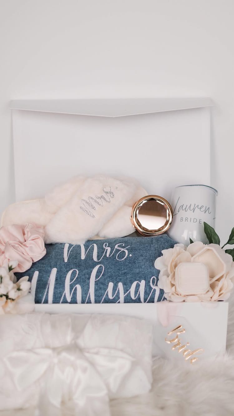 Bridal gift box with personalized denim fabric, white slippers, and a bride mug.
