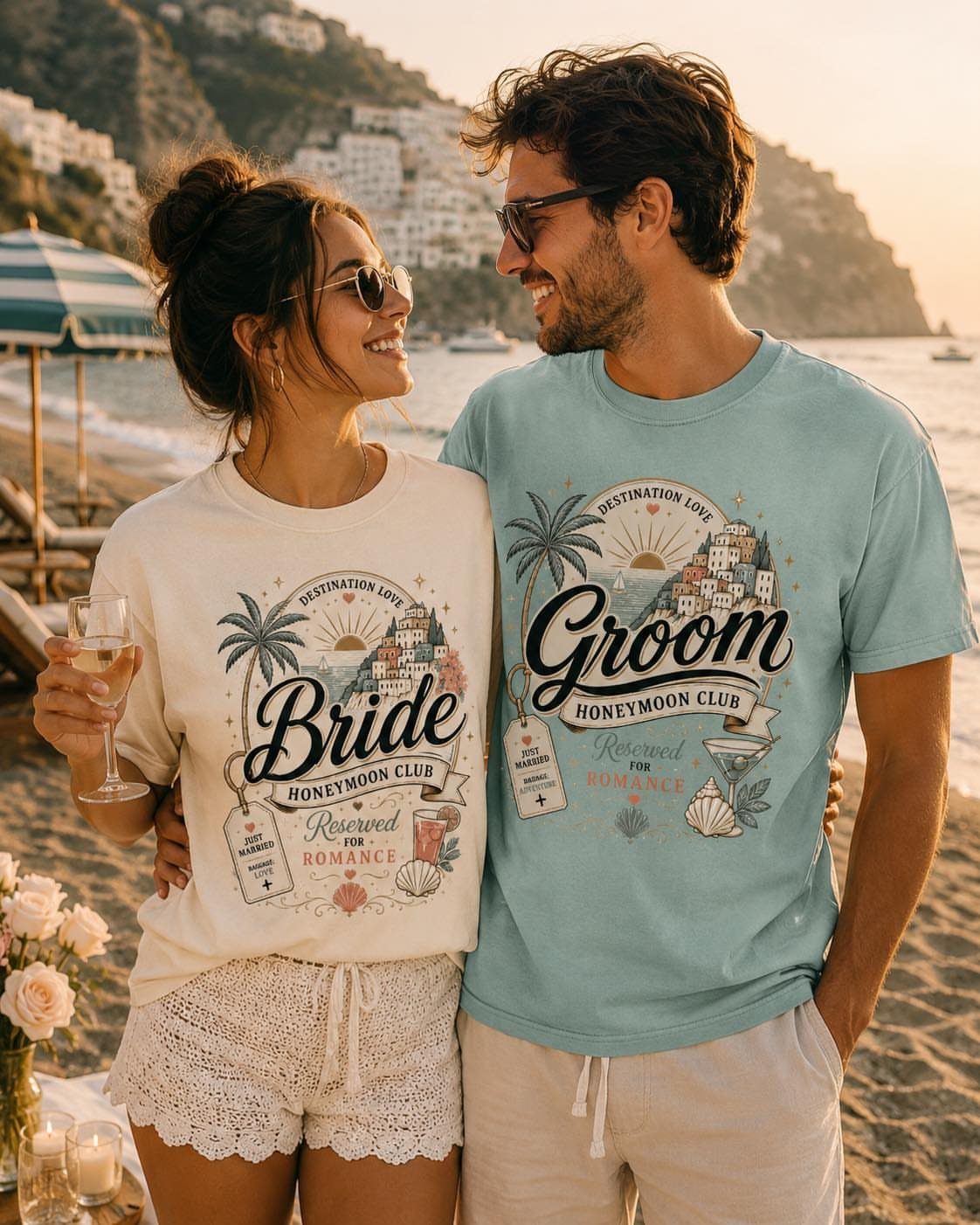 Couple on a beach wearing matching Bride and Groom honeymoon club t-shirts.