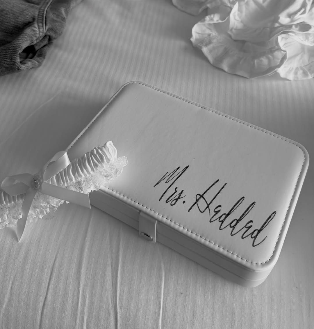 White personalized jewelry box with Mrs. Haddad script and a lace garter.