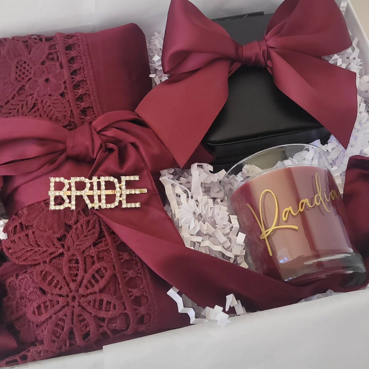 Burgundy lace robe and gold bride pin in a white gift box