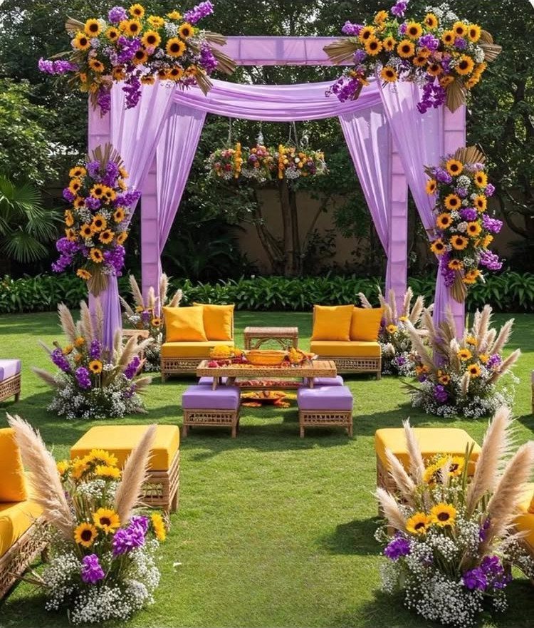 Purple fabric canopy and yellow sofas decorated with sunflowers in an outdoor garden.