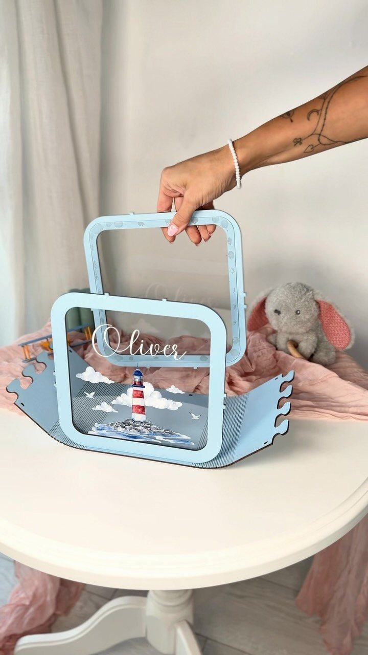 Personalized light blue acrylic ring bearer box with lighthouse design and name Oliver