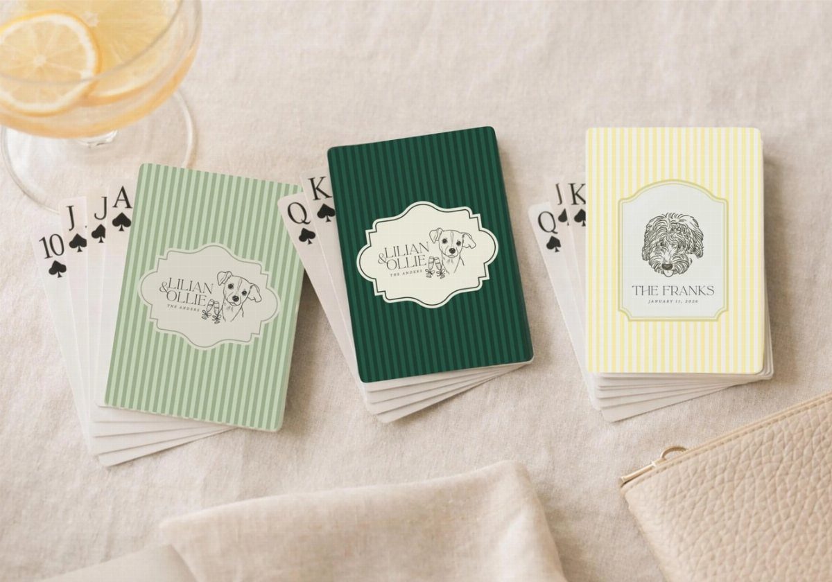 Customized playing card decks with dog illustrations and striped patterns on a table.
