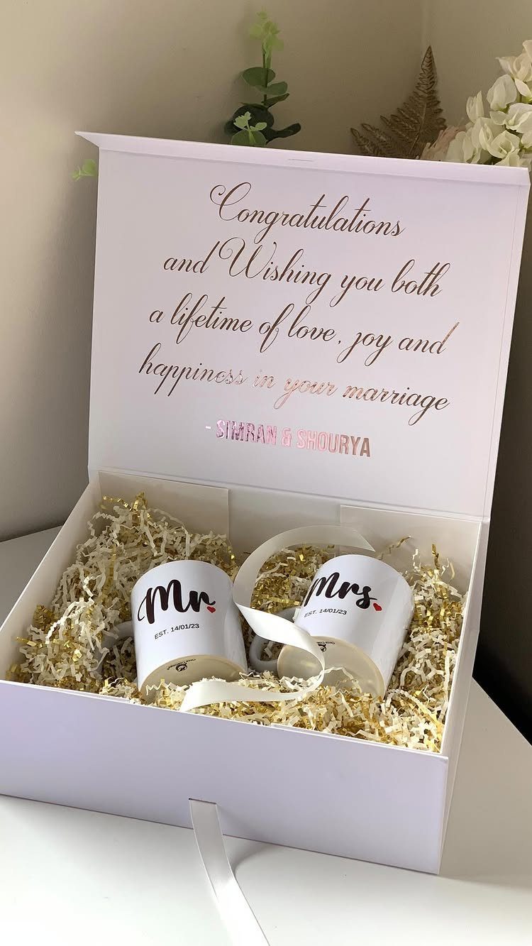 Two Mr and Mrs mugs in a white gift box with gold filler
