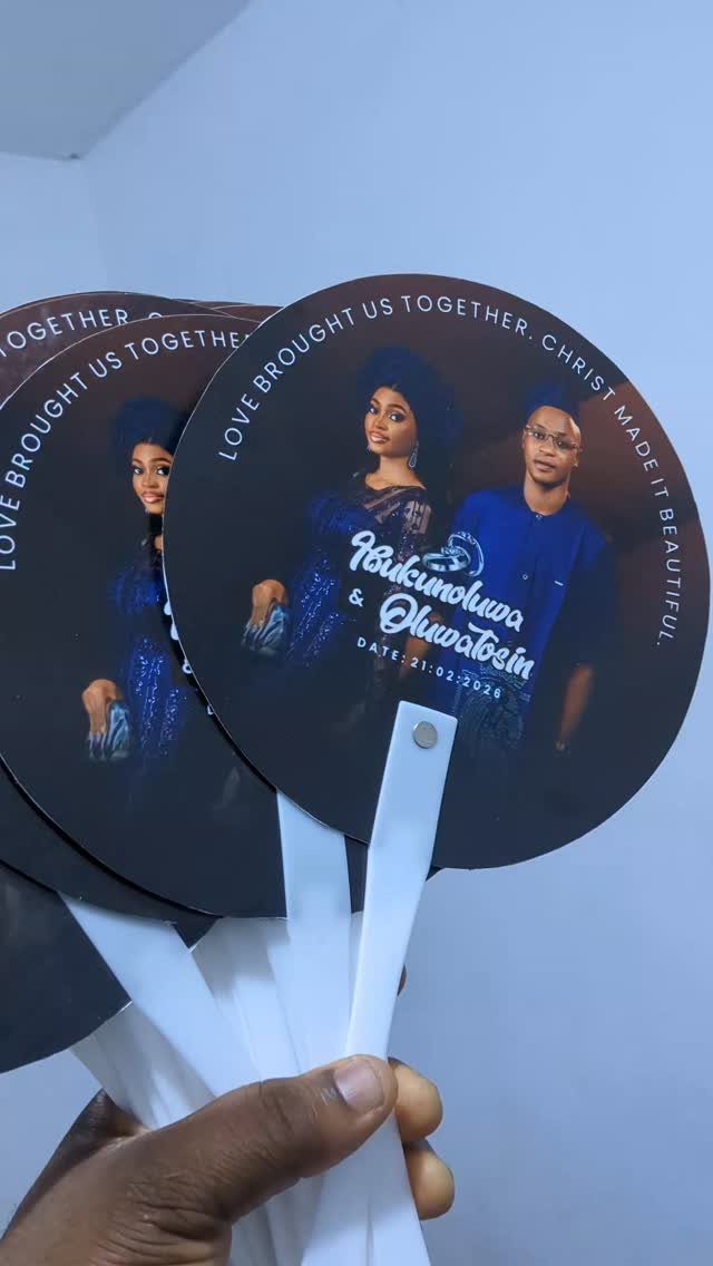 Circular black custom hand fans featuring a couple's photo and wedding text.
