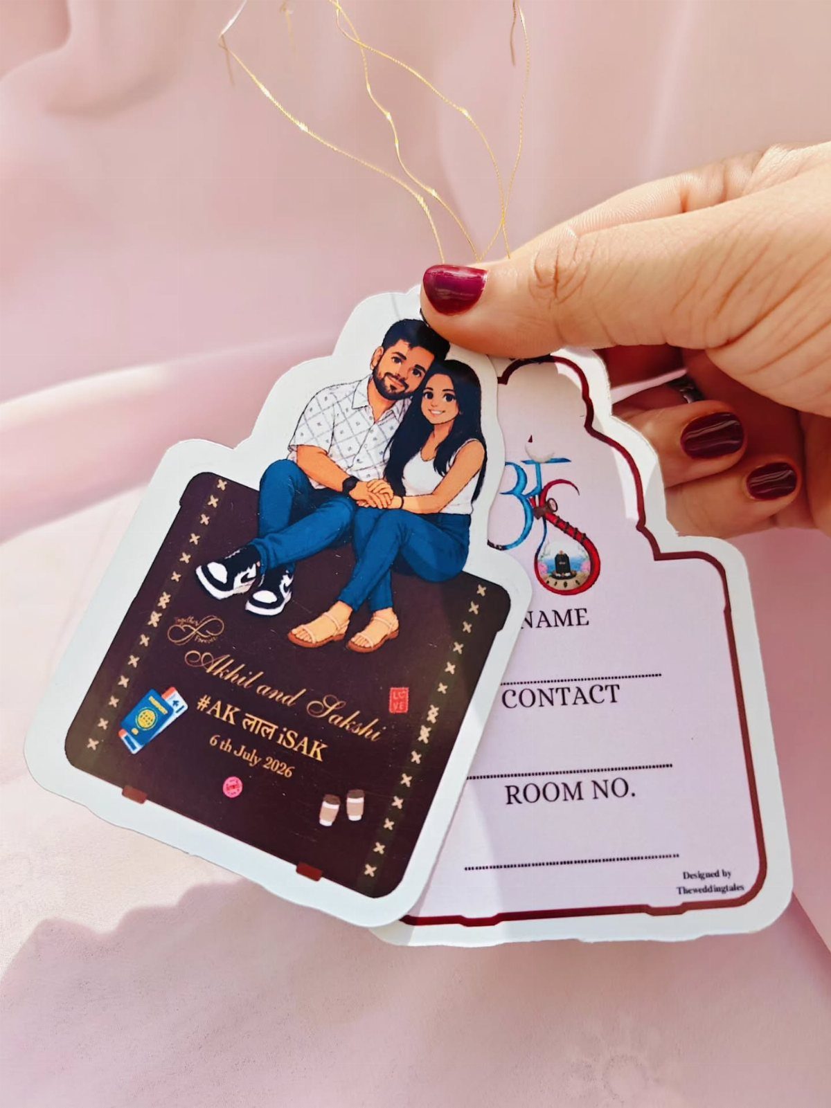 Custom luggage tags featuring a cartoon couple and a contact information card.