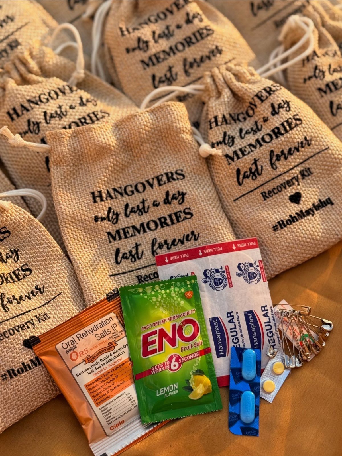 Burlap recovery kits with printed text and various health supplies on wooden table