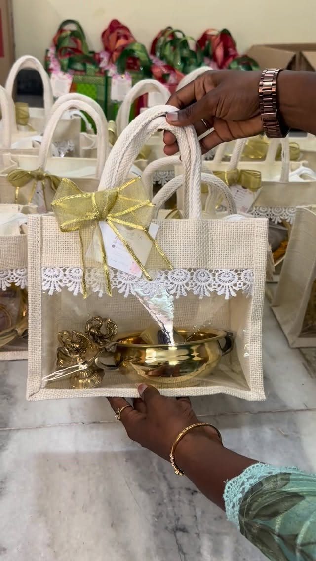 Brass bowl and decorative object inside a decorated jute gift bag.