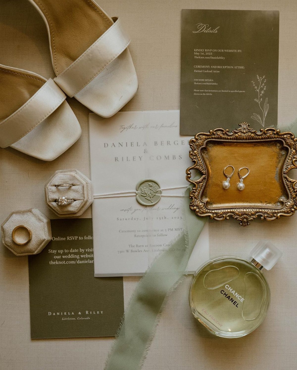 Wedding accessories featuring sage green stationery, white shoes, and gold jewelry on beige background